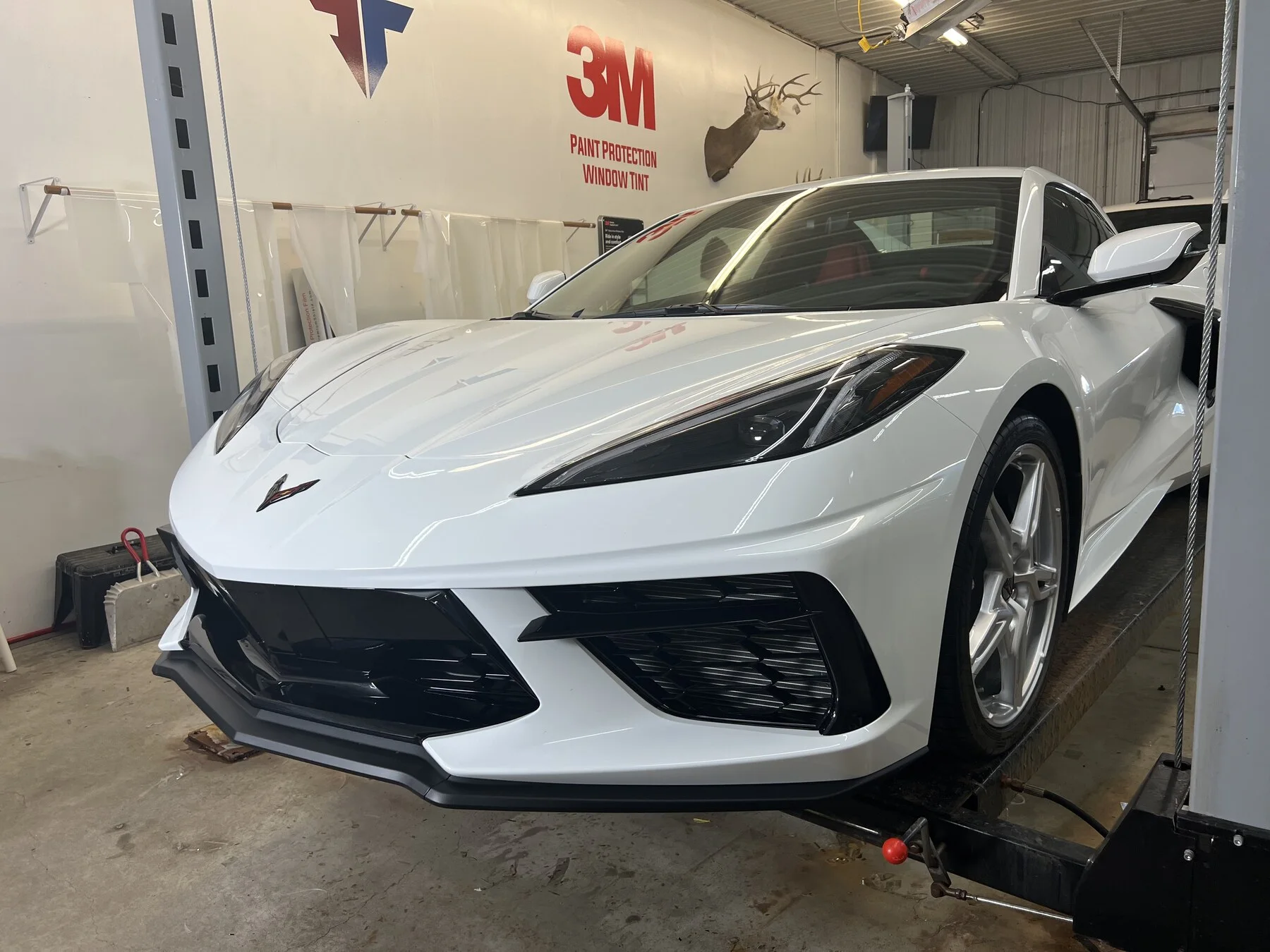 White Corvette inside the Executive Film workshop