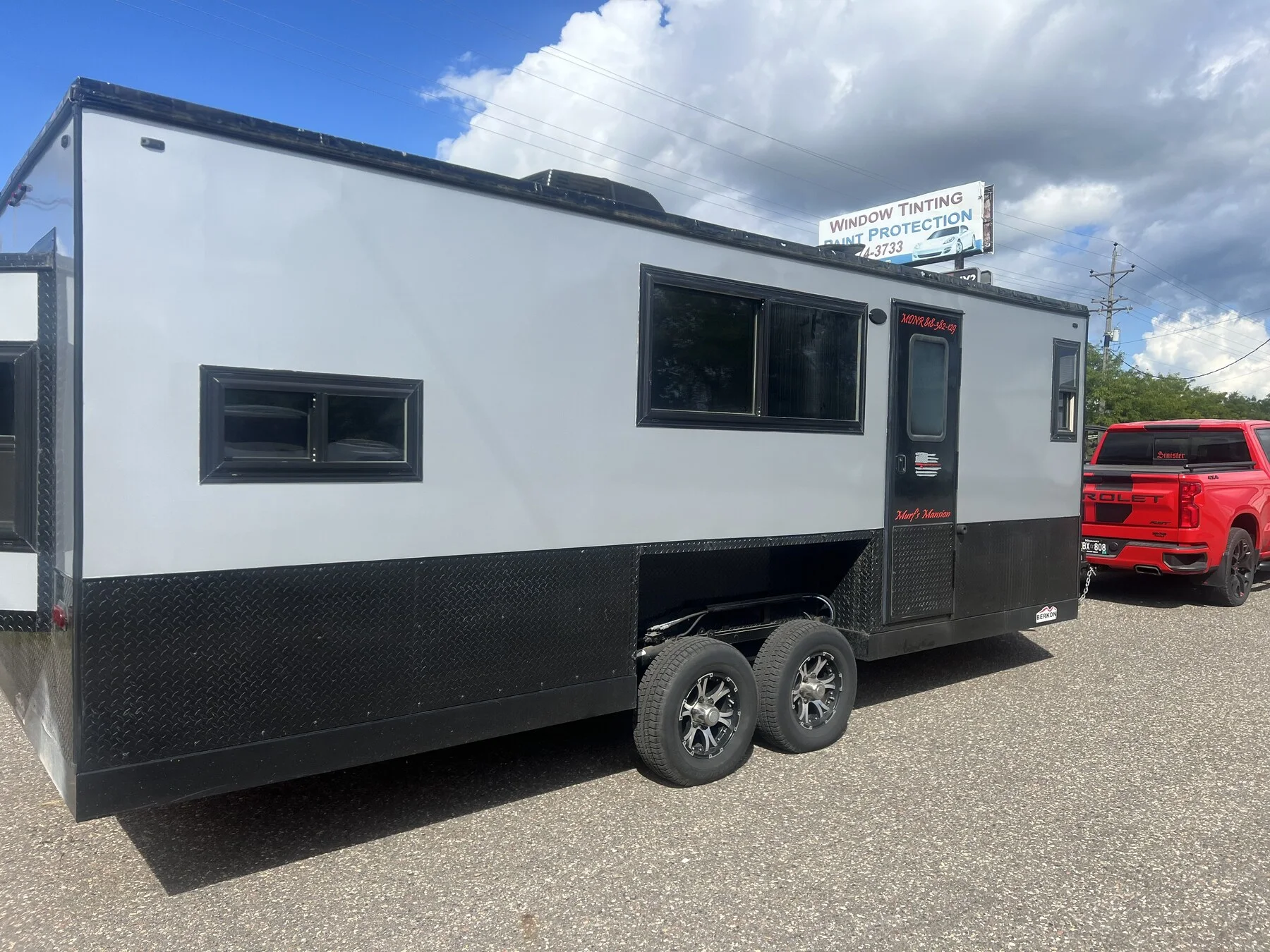 Enclosed recreational trailer with side windows outside